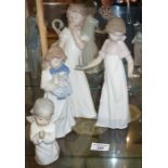 Lladro praying angel child, and three Nao figures