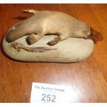 Gilt Bronze figurine of a platypus attached to a pebble by Tony Kean