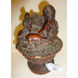Early Black Forest figural carved wooden salt cellar on footed base, some damage, approx. 7" high