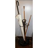 Silver topped walking cane, riding crop and umbrella in repro metal stick stand