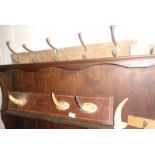 Cow horn coat rack and three others