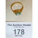 9ct gold dress ring, set with green stones, approx. UK size N and weight 1g