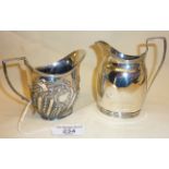 Two Sterling silver milk jugs, hallmarked for London 1901, Carrington & Co., and the other