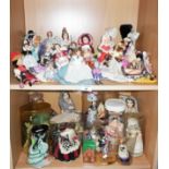 Collection on two shelves of dolls in national costumes