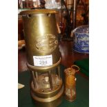 Brass miner's lamp and a souvenir miniature brass miner's lamp commemorating the 1984 miner's