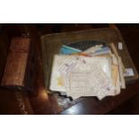 Prayer book, old postcards, and cigarette cards in an album,