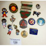 Assorted vintage enamel badges, and a hallmarked silver driving medal. Inc. Robertsons advertising