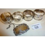 Four Sterling silver napkin rings, and a WHISKY decanter label, all hallmarked. Approx. 116g.