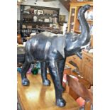 Leather covered elephant sculpture, 34" tall