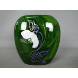 Anita Harris - an Anita Harris vase decorated with white flowers,