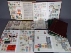 Philately - Nine stock books containing a quantity of UK and foreign postage stamps, revenue stamps,