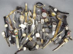 A quantity of vintage wristwatches.