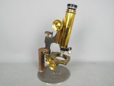 A brass microscope All items must be paid for and collected by close of business Tuesday