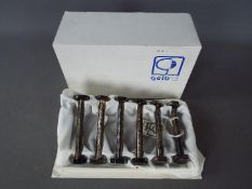 A set of six silver plated knife rests by Gelb of Paris, contained in original box.