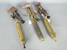 Three vintage brass soldering iron blow lamps including two Max Sievert examples.