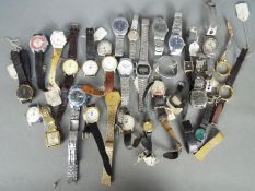 A selection of various wristwatches and watch parts.