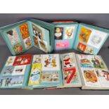 Four Christmas / Greeting Card Albums containing postcards, Christmas cards, birthday cards.