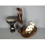 Lot to include a tribal drum, wooden carving of a horse and monkey, wooden bowl and similar.