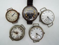 Five trench type watches including one with silver case with import marks,