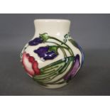 Moorcroft - a Moorcroft vase decorated in the Sweetness pattern,