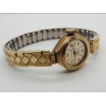 A lady's 9ct gold cased wristwatch on an Excalibur 7 expanding bracelet,