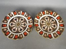 Royal Crown Derby - a pair of Royal Crown Derby cabinet plates decorated in the Imari palette,