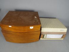 A vintage Pye Black Box record player with Garrard turntable and a Silvertone portable record