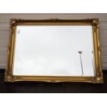 A gilt framed, bevel edged wall mirror, approximately 76 cm x 105 cm.