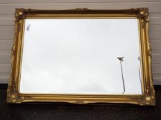 A gilt framed, bevel edged wall mirror, approximately 76 cm x 105 cm.