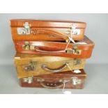 Four good quality vintage cases, all with keys, largest approximately 12 cm x 40 cm x 28 cm.