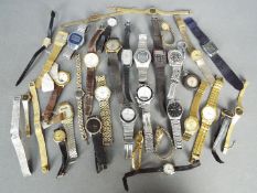 A mixed lot of lady's and gentleman's wristwatches.