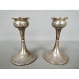 A pair if Edward VII hallmarked silver candlesticks, Birmingham assay 1902, sponsors mark for S.