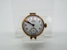 A lady's 9ct gold cased Record wristwatch (lacking bracelet), approximately 11.9 grams all in.