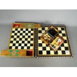 Two chess sets, larger set with 7 cm (h) King.