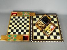 Two chess sets, larger set with 7 cm (h) King.