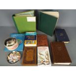 Philately - Two books containing a large collection of worldwide postage stamps,