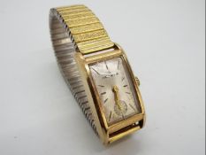 A 9ct gold cased Helvetia wristwatch on later yellow and white metal Fixo Flex expanding bracelet.