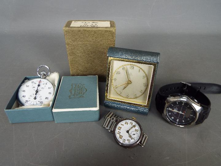 Lot to include a trench type watch having silver case stamped 925, a HAC travel alarm clock,