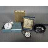 Lot to include a trench type watch having silver case stamped 925, a HAC travel alarm clock,