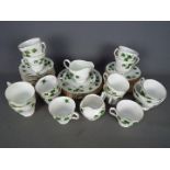 A collection of Colclough tea wares in the Ivy Leaf pattern # 8143, in excess of fifty pieces.