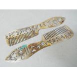 A pair of Egyptian combs decorated with hieroglyphics and other marks, stamped,