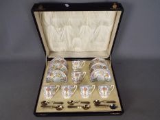 Royal Worcester - A Royal Worcester coffee service contained in fitted case, pattern number 698/1,