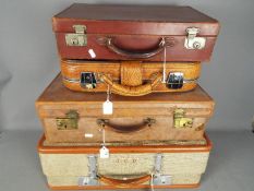 Four pieces of vintage luggage.