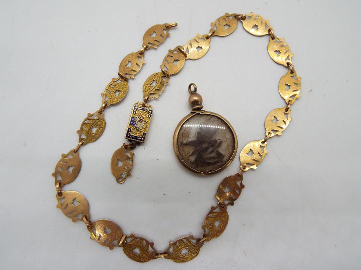 A yellow metal bracelet (a/f) with an enamelled clasp (unmarked) and a pendant with yellow metal
