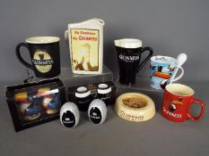 Breweriana - a collection of Guinness branded ceramics to include water jugs, ashtray,