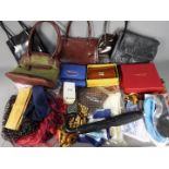 A collection of lady's handbags, silk scarves, purse and similar.