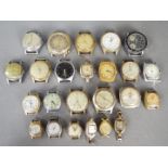 A quantity of various, vintage watch heads.