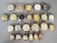 A quantity of various, vintage watch heads.