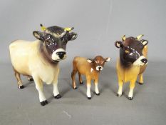 Beswick - a Beswick Jersey bull, cow and calf,