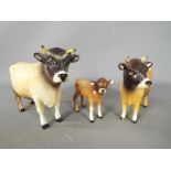 Beswick - a Beswick Jersey bull, cow and calf,